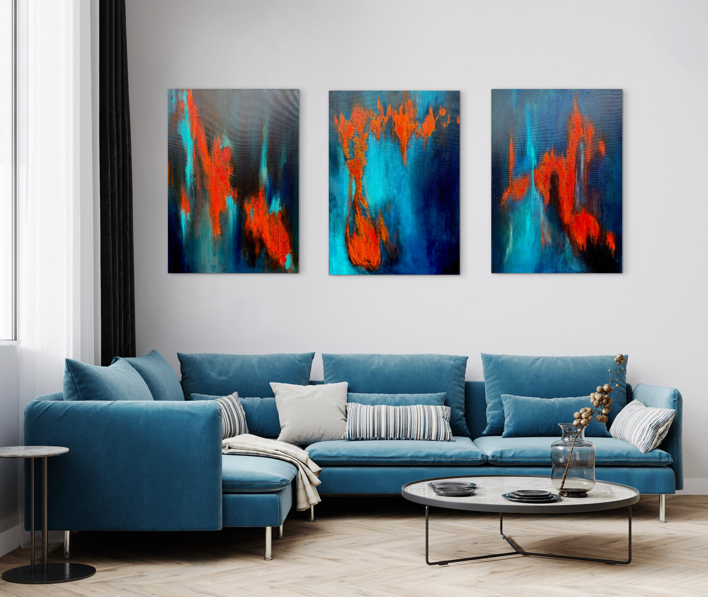 Modern living room with a blue sofa and abstract wall art