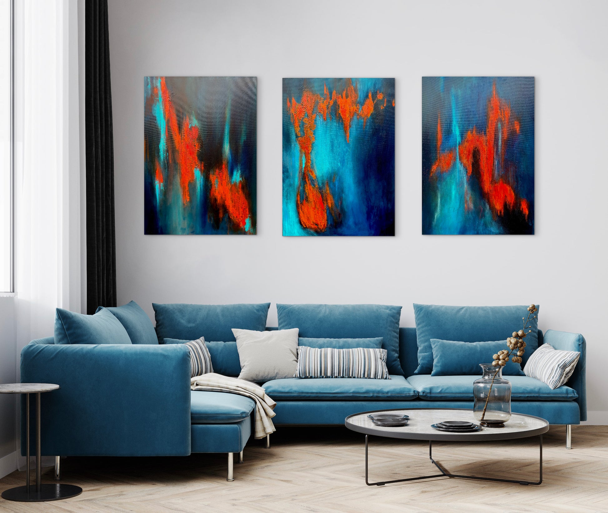Modern living room with a blue sofa and abstract wall art